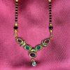 Black and Gold Beaded Necklace with Enamel Details